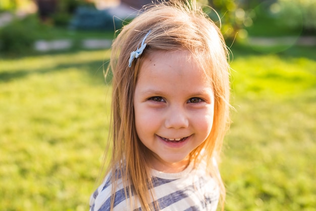 Portrait cute little girl in spring day