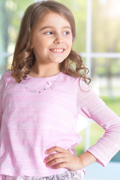 Portrait of cute little girl with curly hair