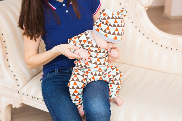 A portrait of a cute newborn baby laughing