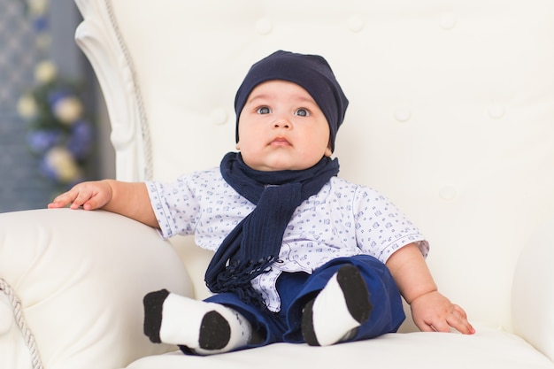 A portrait of a cute newborn baby laughing