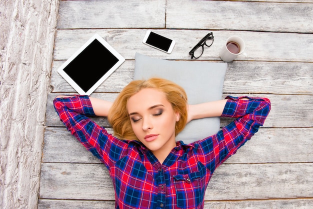 Portrait of cute pretty blonde sleeping on floor