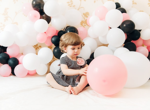 Portrait of cute pretty girl.Balloon background.