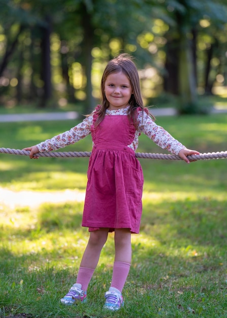 Portrait of a cute pretty girl on a walk happy child childhood