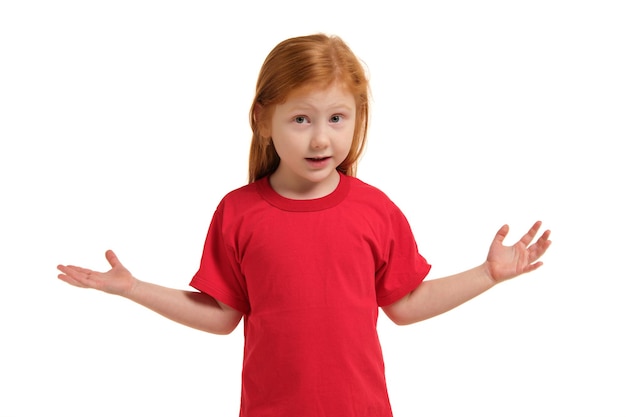 Portrait of cute redhead emotional little girl isolated on a white