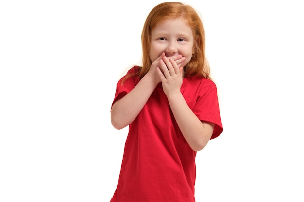 Portrait of cute redhead emotional little girl laughing isolated on a white