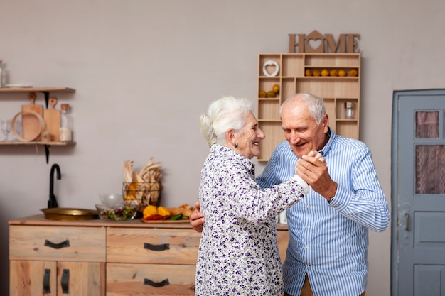 Portrait of cute senior couple dancing