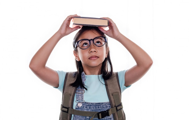 Portrait of cute smart Asian schoolgirl  or kid with eye glasses isolated