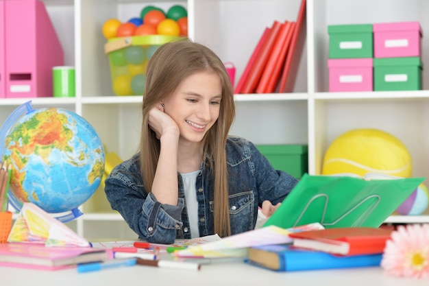 Portrait of a cute student girl at class