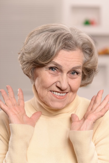 portrait of a cute surprised senior woman