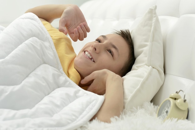 Portrait of a cute waking up boy