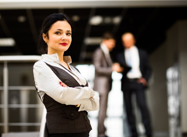 Portrait of a cute young businesswoman smiling in an office environment