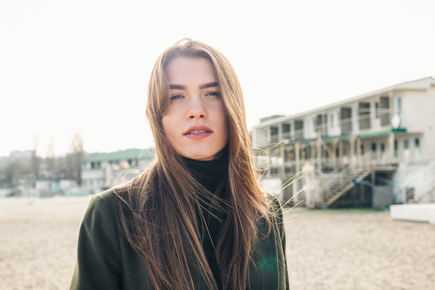 Portrait of a cute young woman with long brown hair