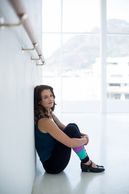 Portrait of dancer relaxing on floor