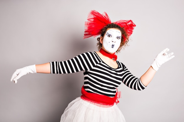 Portrait of a dancing woman mime, april fools day concept