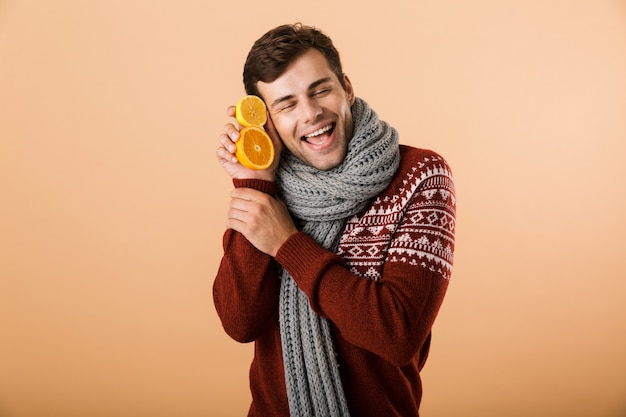 Portrait a delighted man dressed in sweater