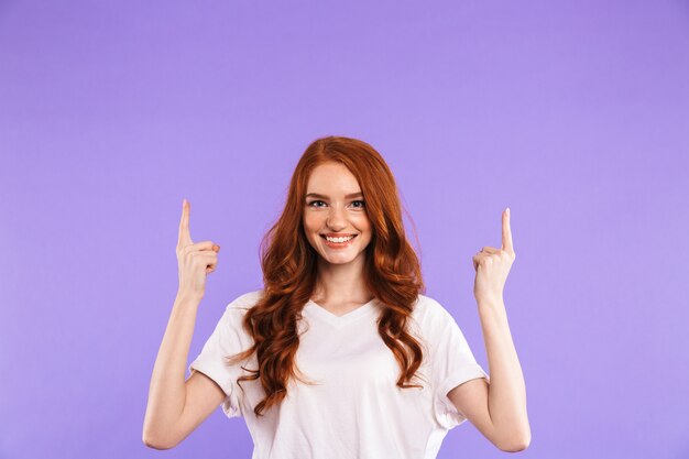 Portrait of a delighted young woman standing