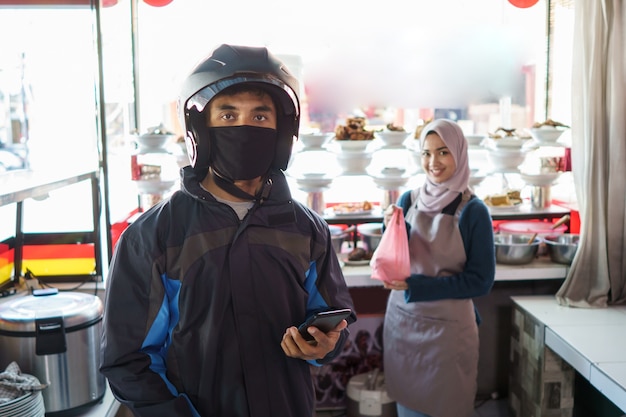 Portrait of a delivery man in the restaurant