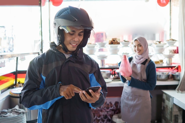 Portrait of a delivery man in the restaurant