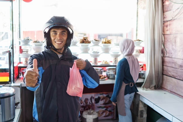 Portrait of a delivery man in the restaurant