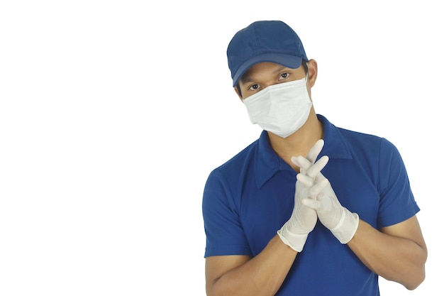 Portrait of delivery man wearing medical mask and medical gloves on white