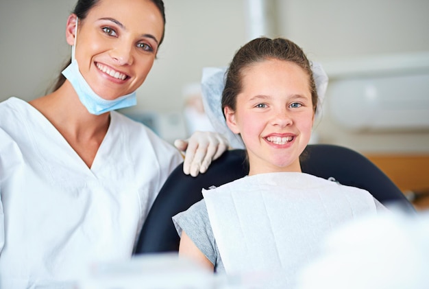 portrait of dentist and child for consulting dental service and teeth whitening for wellness in clinic healthcare dentistry and happy woman and girl hygiene oral care and medical consultation