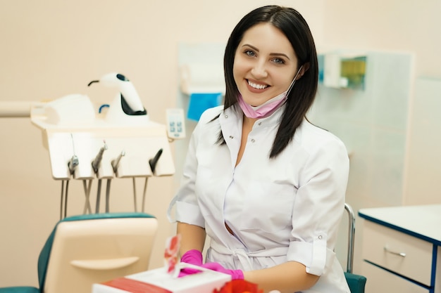 Portrait of a dentist girl in a dental office.