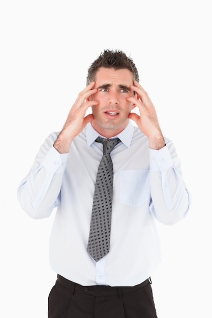 Portrait of a depressed businessman with his hands on his temple