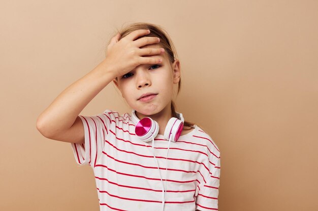 Photo portrait of depressed girl against beige background