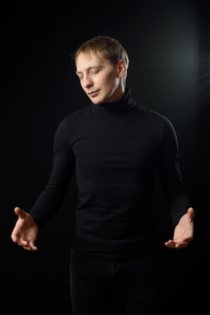 Portrait of determined goodlooking man wearing black shirt.