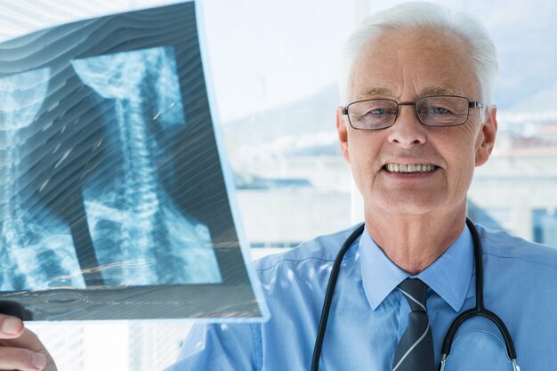 Portrait of doctor analyzing x-ray report