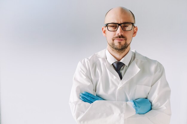 Portrait of a doctor in blue protective gloves