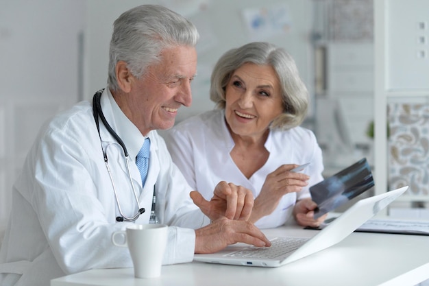 Portrait of doctor and famale patient in office