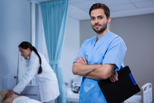 Portrait of doctor holding clipboard