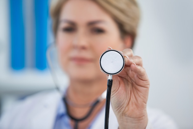 Portrait of doctor holding stethoscope