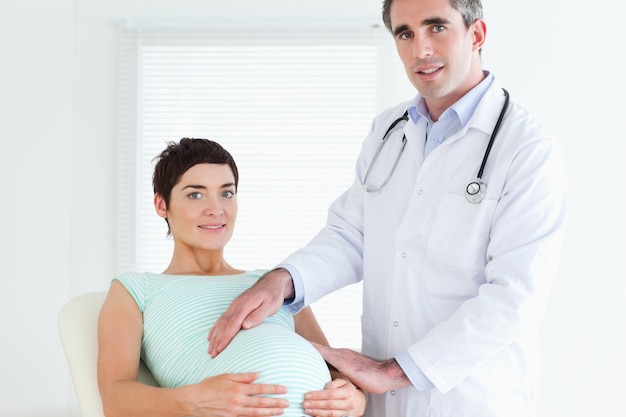 Portrait of a doctor and a pregnant woman