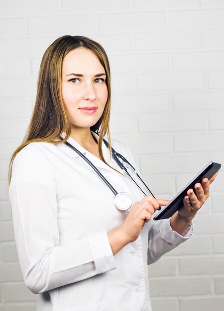 Portrait of a doctor using a digital tablet