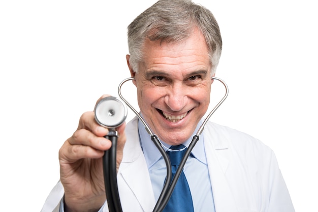 Photo portrait of a doctor using his stethoscope. isolated on white background