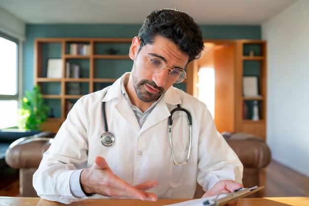 Portrait of a doctor on a video call for a virtual appointment with a patient. Health care and medicine concept.