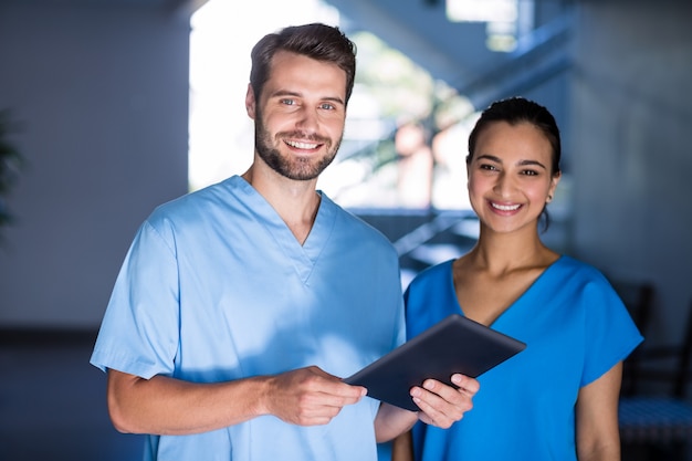 portrait of doctors using digital tablet