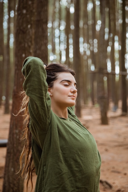 Portrait of a dreads young woman outdoors relaxing