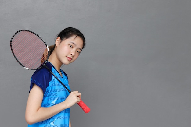 Portrait East Asian girl teen Badminton young athlete happy smile with space for text