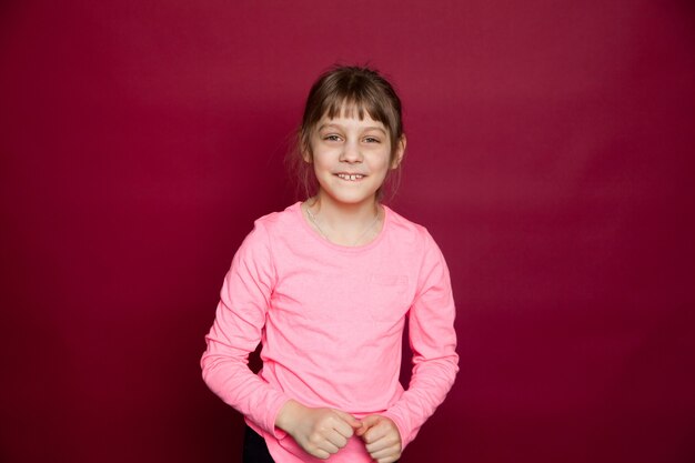 Portrait of eight years old girl with pink blouse