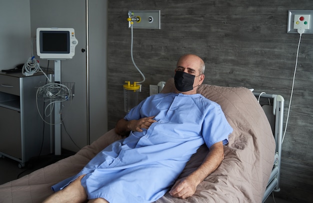 Portrait of an elderly man in hospital bed, close-up