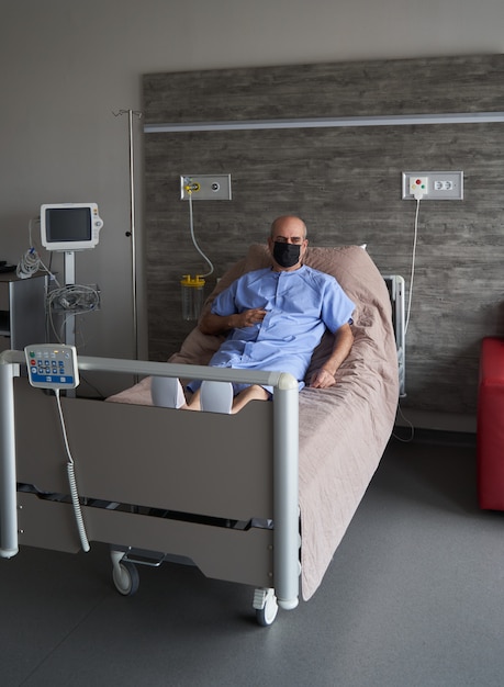 Portrait of an elderly man in hospital bed, close-up