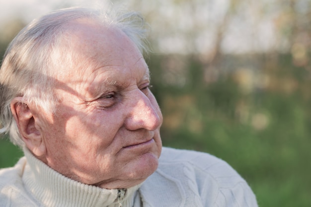 Portrait of  elderly man in  park