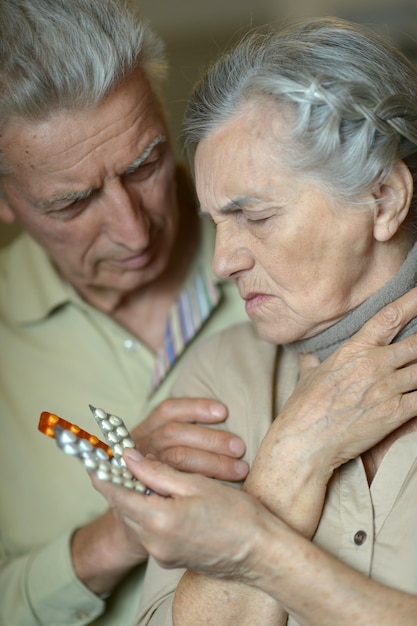 Portrait of elderly man and woman with flu