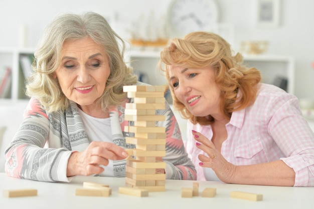 Portrait of elderly people playing a board game