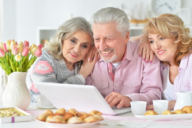 Portrait of an elderly people using a laptop