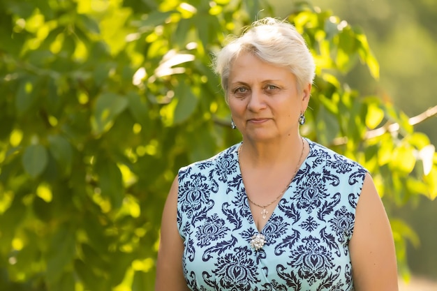 Portrait of the elderly woman. A photo on outdoors