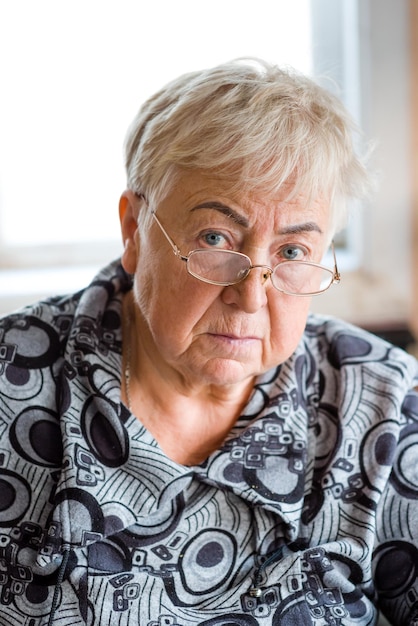 Portrait of an elderly woman with glasses